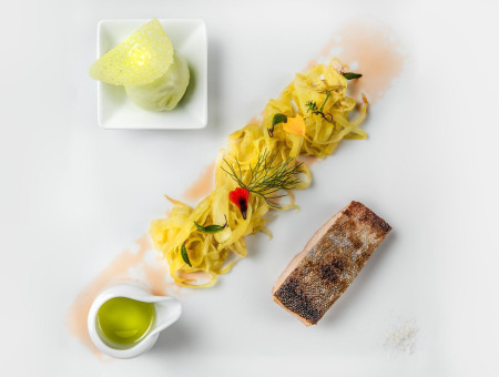 Fischgericht mit Gemüse und Kräuteröl – frische alpine Küche im Scalottas Terroir Lenzerheide